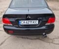 Чорний Міцубісі Lancer, об'ємом двигуна 1.6 л та пробігом 273 тис. км за 3999 $, фото 15 на Automoto.ua