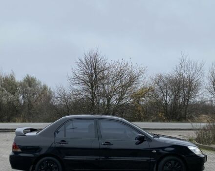 Черный Мицубиси Лансер, объемом двигателя 1.6 л и пробегом 263 тыс. км за 2900 $, фото 7 на Automoto.ua