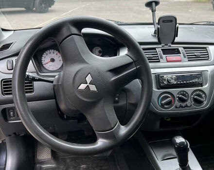 Чорний Міцубісі Lancer, об'ємом двигуна 1.58 л та пробігом 256 тис. км за 4200 $, фото 11 на Automoto.ua