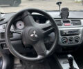 Чорний Міцубісі Lancer, об'ємом двигуна 1.58 л та пробігом 256 тис. км за 4200 $, фото 11 на Automoto.ua