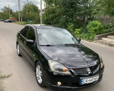 Чорний Міцубісі Lancer, об'ємом двигуна 2 л та пробігом 258 тис. км за 5200 $, фото 4 на Automoto.ua