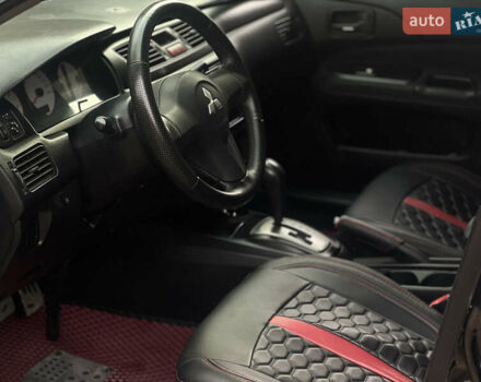 Черный Мицубиси Лансер, объемом двигателя 1.6 л и пробегом 211 тыс. км за 5700 $, фото 27 на Automoto.ua