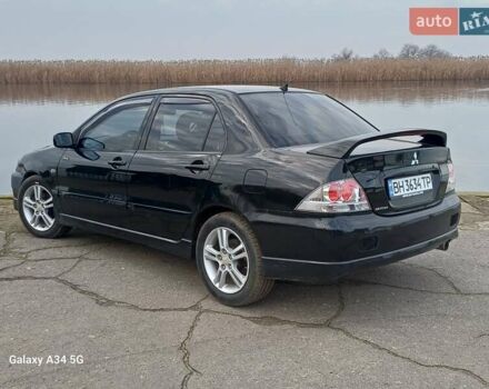 Черный Мицубиси Лансер, объемом двигателя 2 л и пробегом 286 тыс. км за 4000 $, фото 7 на Automoto.ua