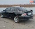 Черный Мицубиси Лансер, объемом двигателя 2 л и пробегом 286 тыс. км за 4000 $, фото 7 на Automoto.ua