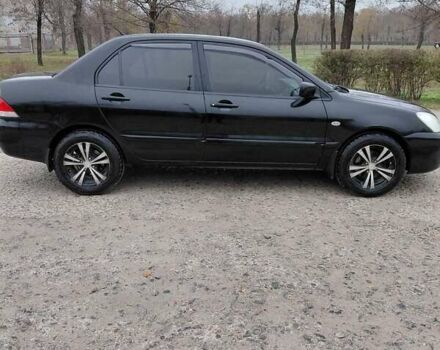 Чорний Міцубісі Lancer, об'ємом двигуна 1.58 л та пробігом 201 тис. км за 4500 $, фото 3 на Automoto.ua