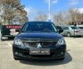Чорний Міцубісі Lancer, об'ємом двигуна 1.6 л та пробігом 226 тис. км за 3899 $, фото 1 на Automoto.ua