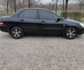 Чорний Міцубісі Lancer, об'ємом двигуна 1.58 л та пробігом 201 тис. км за 4500 $, фото 3 на Automoto.ua