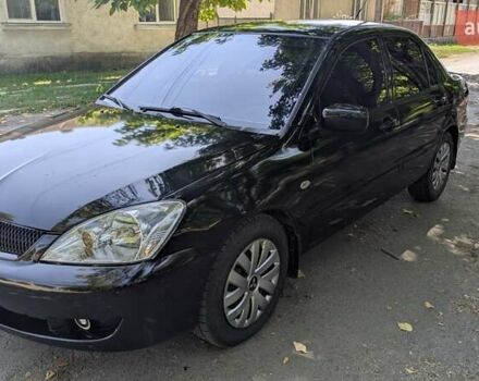 Чорний Міцубісі Lancer, об'ємом двигуна 1.6 л та пробігом 366 тис. км за 3500 $, фото 3 на Automoto.ua
