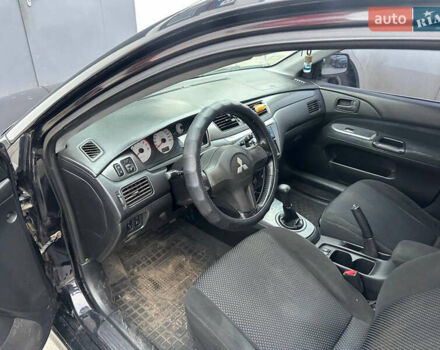 Черный Мицубиси Лансер, объемом двигателя 1.58 л и пробегом 290 тыс. км за 3000 $, фото 8 на Automoto.ua