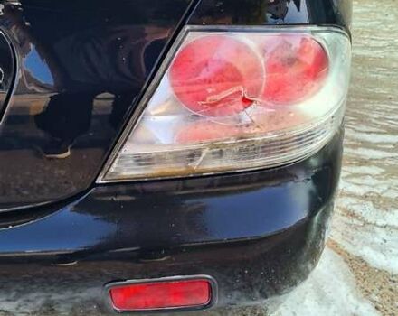 Черный Мицубиси Лансер, объемом двигателя 1.6 л и пробегом 185 тыс. км за 3300 $, фото 3 на Automoto.ua