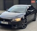 Черный Мицубиси Лансер, объемом двигателя 2 л и пробегом 150 тыс. км за 6750 $, фото 1 на Automoto.ua