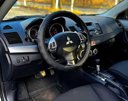 Черный Мицубиси Лансер, объемом двигателя 2 л и пробегом 224 тыс. км за 7000 $, фото 1 на Automoto.ua