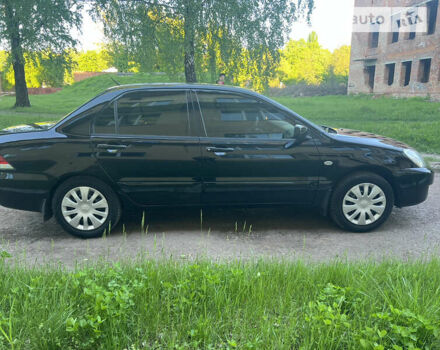 Чорний Міцубісі Lancer, об'ємом двигуна 1.58 л та пробігом 163 тис. км за 4850 $, фото 8 на Automoto.ua