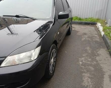 Черный Мицубиси Лансер, объемом двигателя 1.58 л и пробегом 180 тыс. км за 4500 $, фото 2 на Automoto.ua