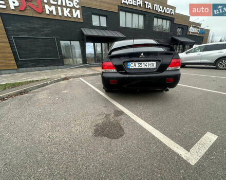 Черный Мицубиси Лансер, объемом двигателя 1.58 л и пробегом 290 тыс. км за 3000 $, фото 5 на Automoto.ua