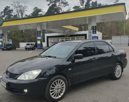 Чорний Міцубісі Lancer, об'ємом двигуна 1.58 л та пробігом 190 тис. км за 3750 $, фото 2 на Automoto.ua