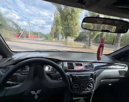 Черный Мицубиси Лансер, объемом двигателя 1.6 л и пробегом 244 тыс. км за 4100 $, фото 8 на Automoto.ua