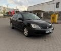 Чорний Міцубісі Lancer, об'ємом двигуна 1.6 л та пробігом 999 тис. км за 1905 $, фото 1 на Automoto.ua