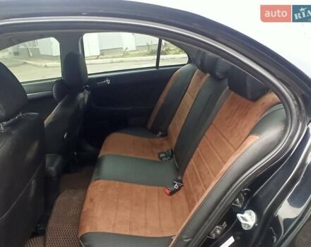 Черный Мицубиси Лансер, объемом двигателя 2 л и пробегом 195 тыс. км за 7899 $, фото 11 на Automoto.ua