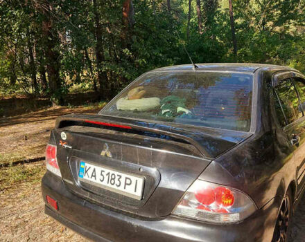 Чорний Міцубісі Lancer, об'ємом двигуна 2 л та пробігом 290 тис. км за 3300 $, фото 3 на Automoto.ua