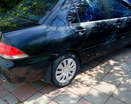 Черный Мицубиси Лансер, объемом двигателя 1.6 л и пробегом 247 тыс. км за 4000 $, фото 2 на Automoto.ua