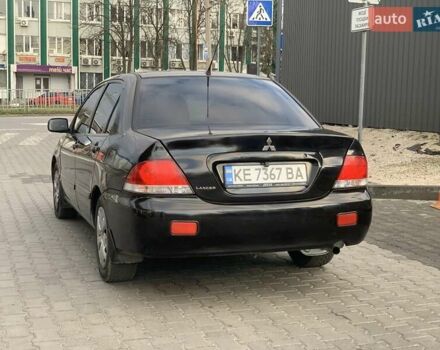 Черный Мицубиси Лансер, объемом двигателя 1.58 л и пробегом 237 тыс. км за 3850 $, фото 2 на Automoto.ua