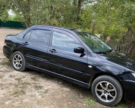 Чорний Міцубісі Lancer, об'ємом двигуна 1.58 л та пробігом 231 тис. км за 4300 $, фото 1 на Automoto.ua