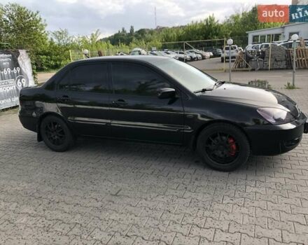 Чорний Міцубісі Lancer, об'ємом двигуна 1.59 л та пробігом 179 тис. км за 4980 $, фото 1 на Automoto.ua