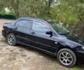 Чорний Міцубісі Lancer, об'ємом двигуна 1.58 л та пробігом 231 тис. км за 4300 $, фото 1 на Automoto.ua