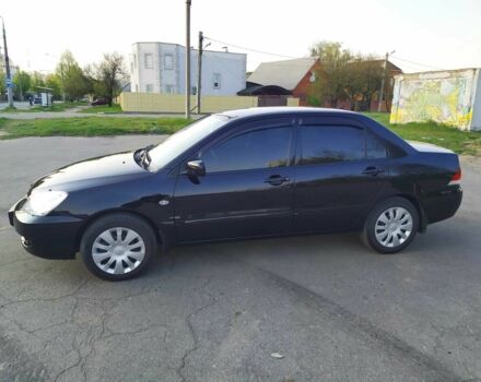 Черный Мицубиси Лансер, объемом двигателя 1.6 л и пробегом 32 тыс. км за 9000 $, фото 3 на Automoto.ua