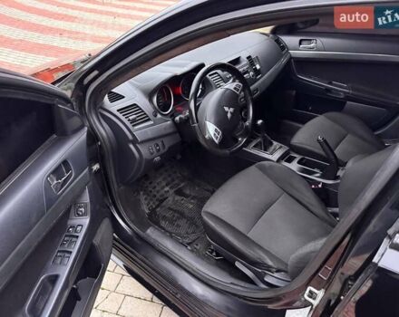 Черный Мицубиси Лансер, объемом двигателя 2 л и пробегом 217 тыс. км за 5500 $, фото 9 на Automoto.ua