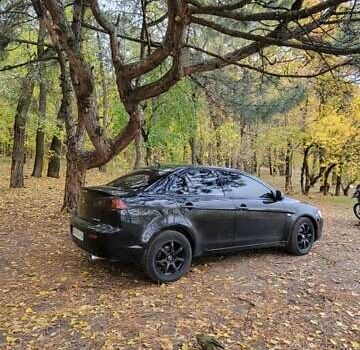 Черный Мицубиси Лансер, объемом двигателя 2 л и пробегом 260 тыс. км за 5500 $, фото 5 на Automoto.ua