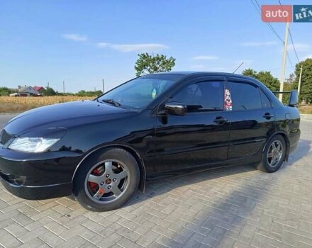 Черный Мицубиси Лансер, объемом двигателя 1.6 л и пробегом 320 тыс. км за 4500 $, фото 2 на Automoto.ua