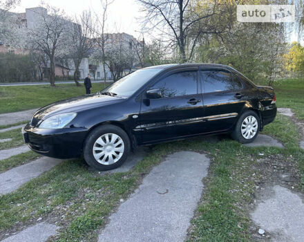 Чорний Міцубісі Lancer, об'ємом двигуна 1.58 л та пробігом 161 тис. км за 5300 $, фото 5 на Automoto.ua