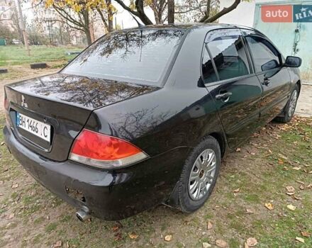 Чорний Міцубісі Lancer, об'ємом двигуна 1.58 л та пробігом 227 тис. км за 4100 $, фото 3 на Automoto.ua