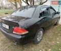 Чорний Міцубісі Lancer, об'ємом двигуна 1.58 л та пробігом 227 тис. км за 4100 $, фото 3 на Automoto.ua