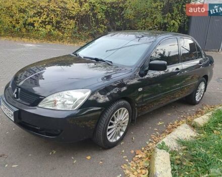 Чорний Міцубісі Lancer, об'ємом двигуна 1.58 л та пробігом 190 тис. км за 3750 $, фото 16 на Automoto.ua