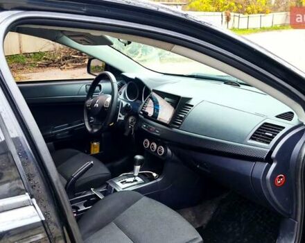 Черный Мицубиси Лансер, объемом двигателя 2 л и пробегом 230 тыс. км за 7100 $, фото 3 на Automoto.ua