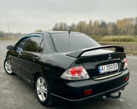 Черный Мицубиси Лансер, объемом двигателя 2 л и пробегом 260 тыс. км за 5300 $, фото 4 на Automoto.ua