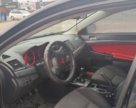 Черный Мицубиси Лансер, объемом двигателя 2 л и пробегом 160 тыс. км за 8000 $, фото 9 на Automoto.ua