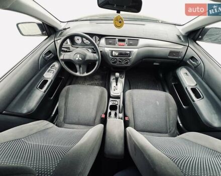 Чорний Міцубісі Lancer, об'ємом двигуна 1.6 л та пробігом 243 тис. км за 4950 $, фото 49 на Automoto.ua