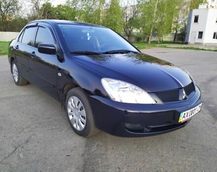 Черный Мицубиси Лансер, объемом двигателя 1.6 л и пробегом 32 тыс. км за 9000 $, фото 8 на Automoto.ua