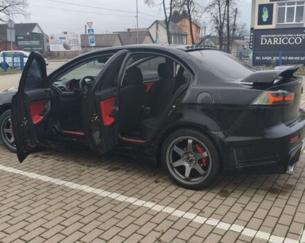 Черный Мицубиси Лансер, объемом двигателя 2 л и пробегом 160 тыс. км за 8000 $, фото 7 на Automoto.ua