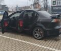 Черный Мицубиси Лансер, объемом двигателя 2 л и пробегом 160 тыс. км за 8000 $, фото 7 на Automoto.ua