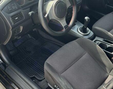 Черный Мицубиси Лансер, объемом двигателя 2 л и пробегом 224 тыс. км за 5800 $, фото 5 на Automoto.ua