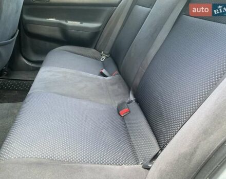 Черный Мицубиси Лансер, объемом двигателя 1.58 л и пробегом 237 тыс. км за 3999 $, фото 5 на Automoto.ua