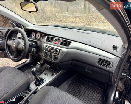 Черный Мицубиси Лансер, объемом двигателя 1.6 л и пробегом 216 тыс. км за 4990 $, фото 18 на Automoto.ua