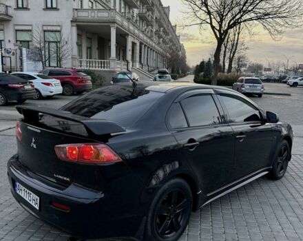 Черный Мицубиси Лансер, объемом двигателя 2 л и пробегом 242 тыс. км за 6200 $, фото 10 на Automoto.ua