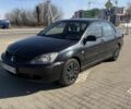Черный Мицубиси Лансер, объемом двигателя 1.6 л и пробегом 300 тыс. км за 2999 $, фото 1 на Automoto.ua