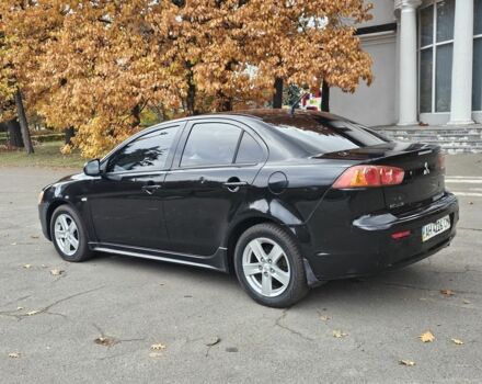 Черный Мицубиси Лансер, объемом двигателя 2 л и пробегом 115 тыс. км за 5000 $, фото 4 на Automoto.ua